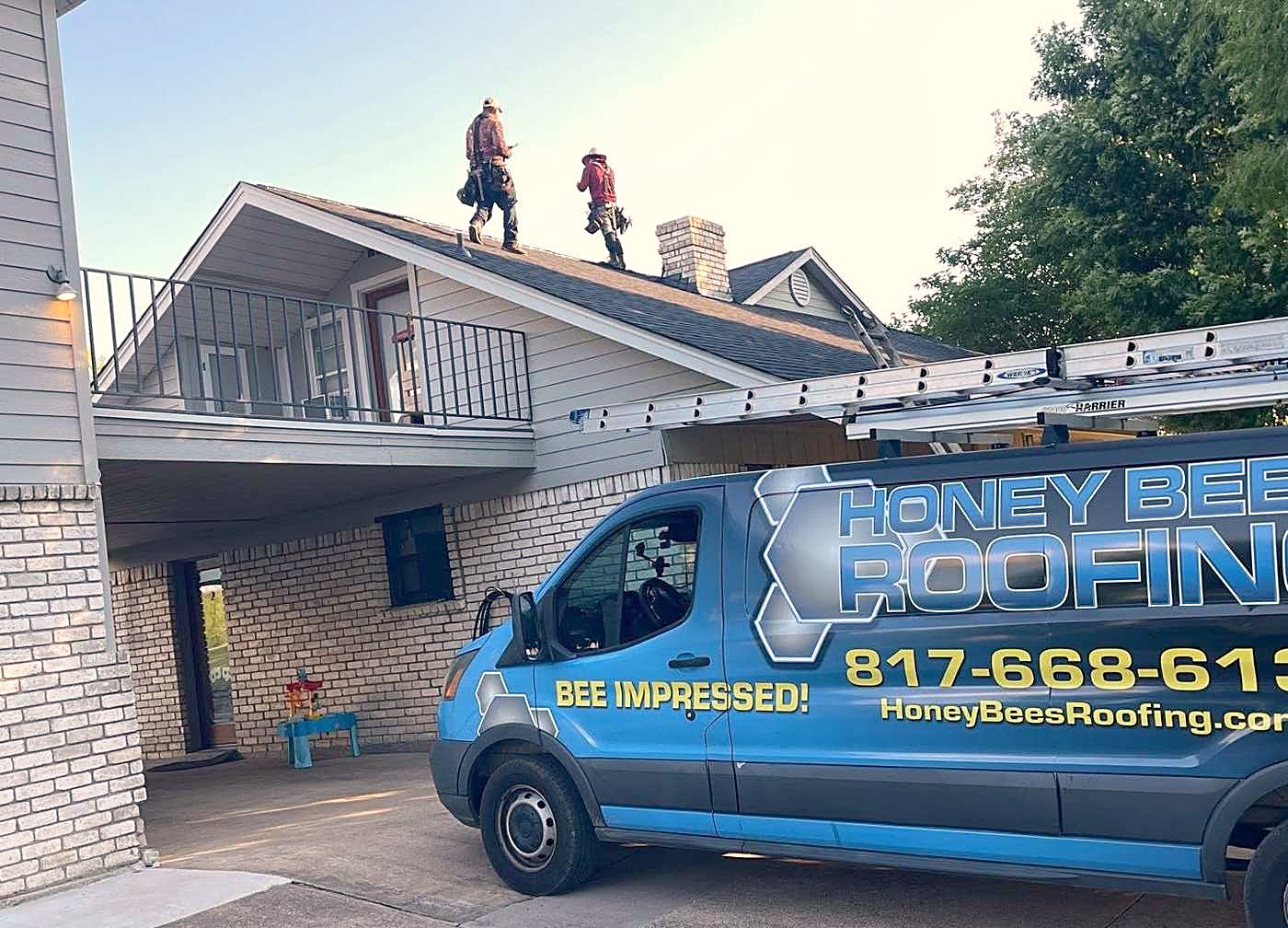 The Honey Bees Roofing crew on a job site