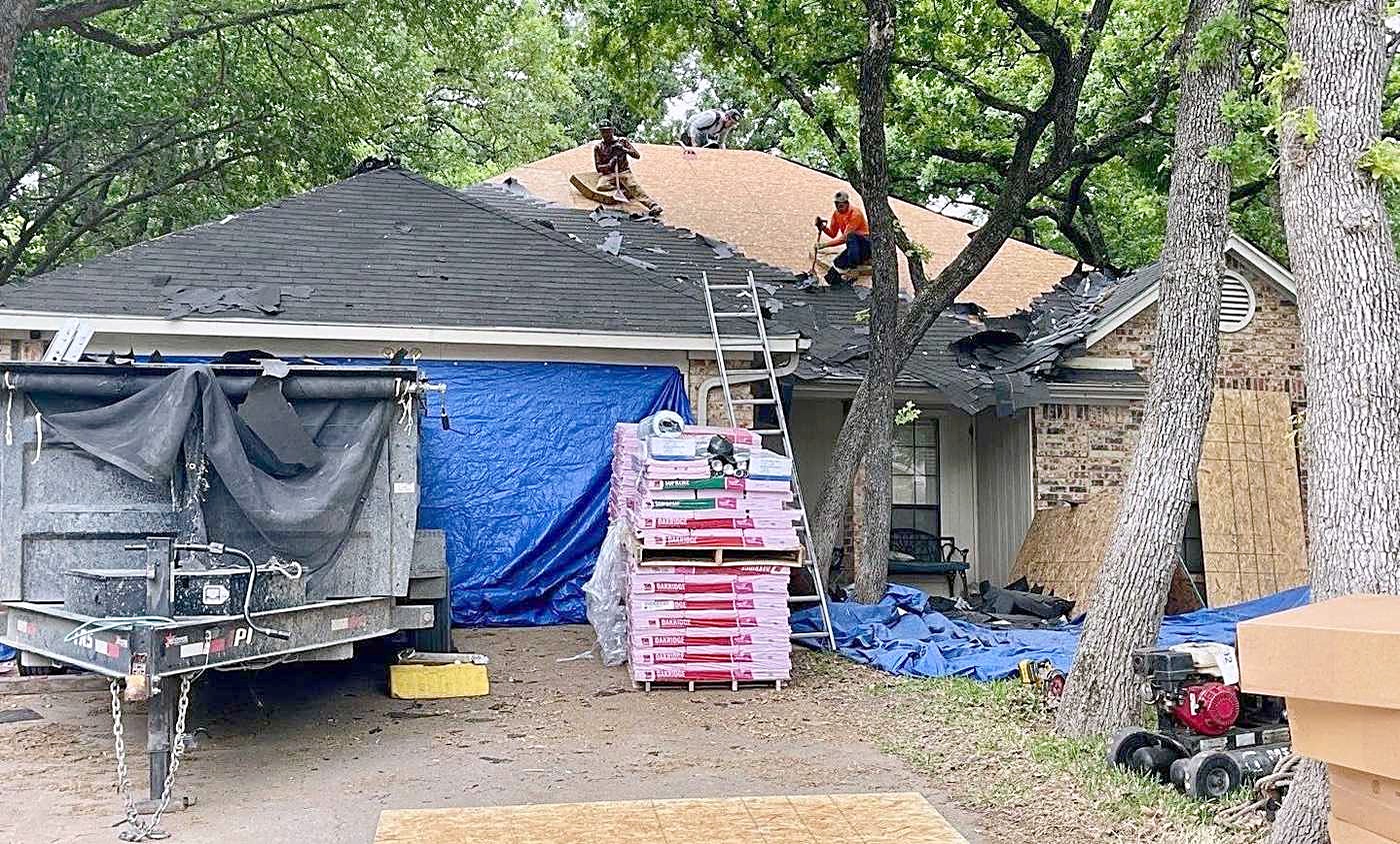 The dump trailer and the cleared drive at the end of a tear-off